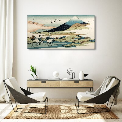 Canvas schilderij Kranen bij een berg