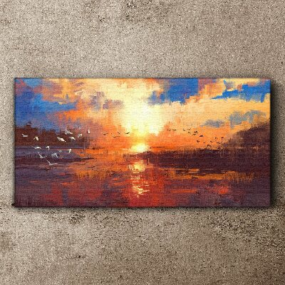 Schilderij op doek Zonsondergang boven een kalm meer