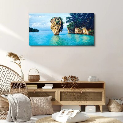 Foto op canvas Een kalme baai met een hoge rots