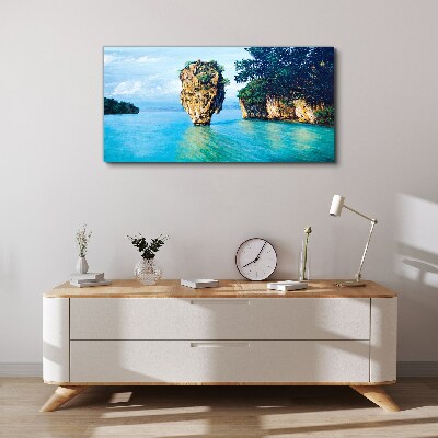 Foto op canvas Een kalme baai met een hoge rots