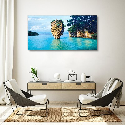 Foto op canvas Een kalme baai met een hoge rots