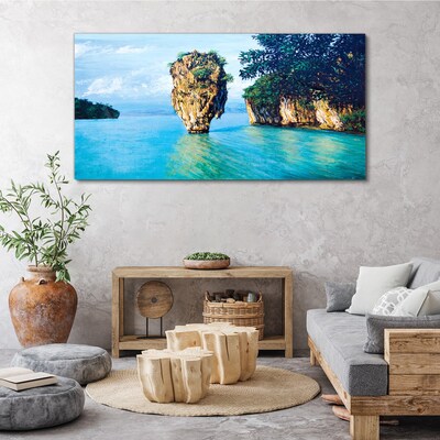 Foto op canvas Een kalme baai met een hoge rots
