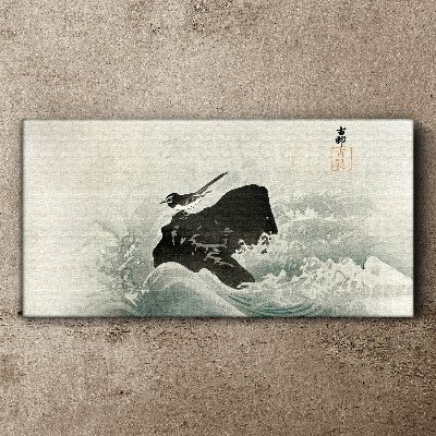 Canvas schilderij Een vogel op een rots in de golven