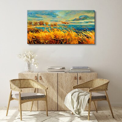 Canvas schilderij Gouden grassen boven blauw water