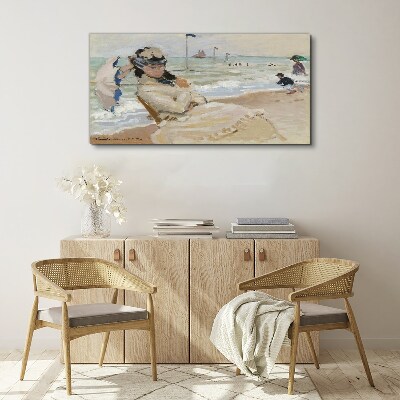 Foto op canvas Vrouw op het strand met een parasol