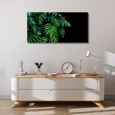 Canvas schilderij Groene bladeren op een zwarte achtergrond