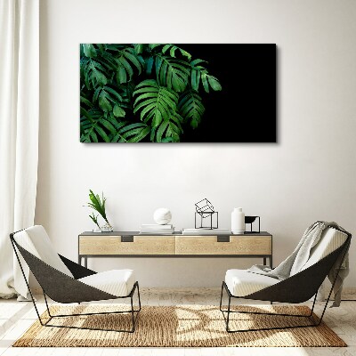 Canvas schilderij Groene bladeren op een zwarte achtergrond