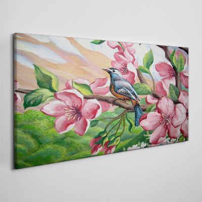 Canvas schilderij Een vogel tegen een achtergrond van lentebloemen
