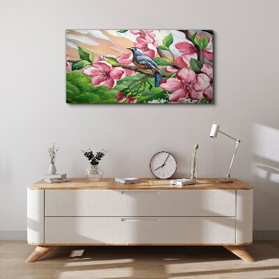 Canvas schilderij Een vogel tegen een achtergrond van lentebloemen