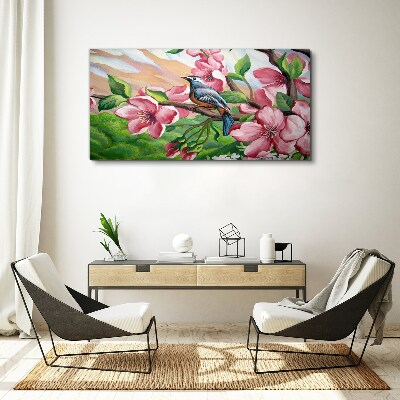 Canvas schilderij Een vogel tegen een achtergrond van lentebloemen