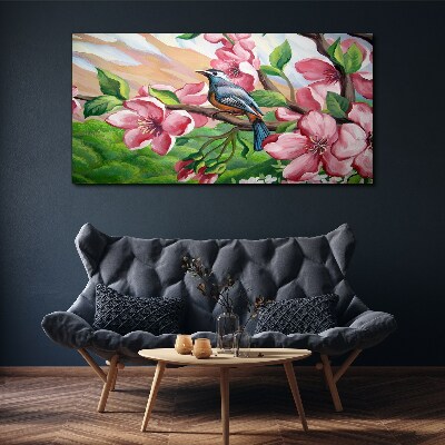 Canvas schilderij Een vogel tegen een achtergrond van lentebloemen