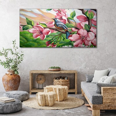Canvas schilderij Een vogel tegen een achtergrond van lentebloemen