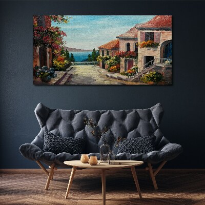 Schilderij op doek Een charmante straat aan zee