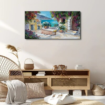 Foto op canvas Een kustplaats in bloemen