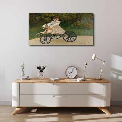 Schilderij op doek Kind op een loopfiets