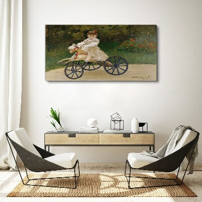 Schilderij op doek Kind op een loopfiets