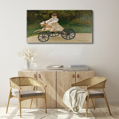 Schilderij op doek Kind op een loopfiets