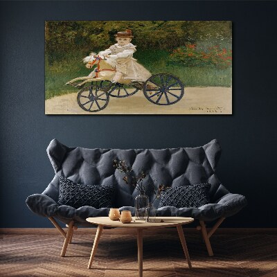 Schilderij op doek Kind op een loopfiets