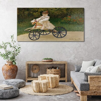 Schilderij op doek Kind op een loopfiets