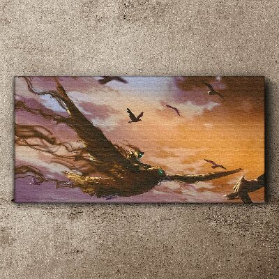 Canvas schilderij Vlucht van vogels in de ondergaande zon