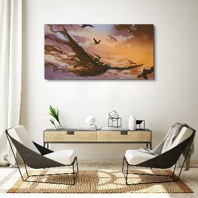 Canvas schilderij Vlucht van vogels in de ondergaande zon