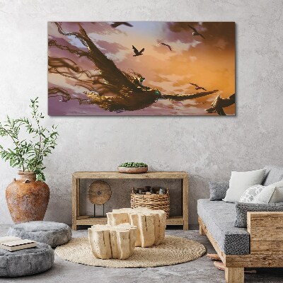 Canvas schilderij Vlucht van vogels in de ondergaande zon