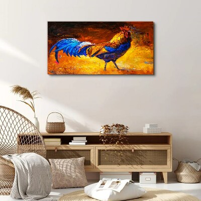 Canvas schilderij Een kleurrijke haan tegen de achtergrond van vuur