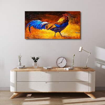 Canvas schilderij Een kleurrijke haan tegen de achtergrond van vuur