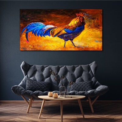 Canvas schilderij Een kleurrijke haan tegen de achtergrond van vuur