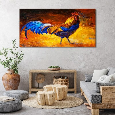 Canvas schilderij Een kleurrijke haan tegen de achtergrond van vuur