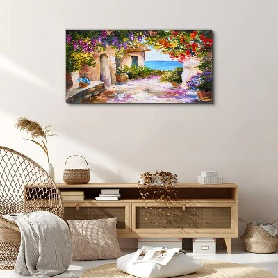 Foto op canvas De bloemenlaan van een kustdorp