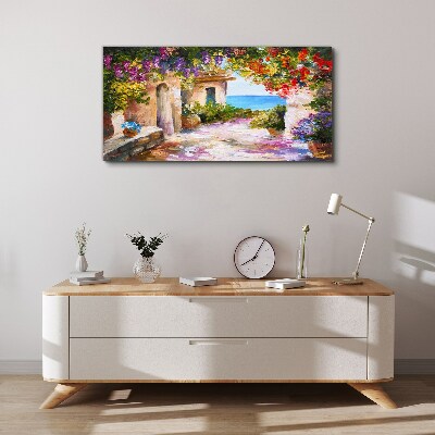 Foto op canvas De bloemenlaan van een kustdorp