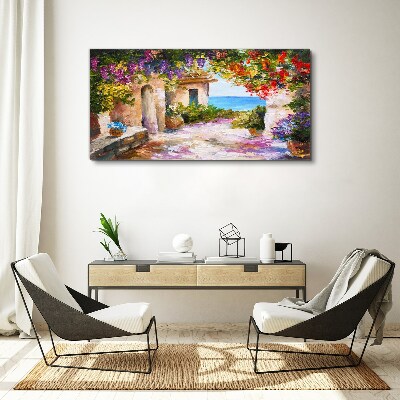 Foto op canvas De bloemenlaan van een kustdorp