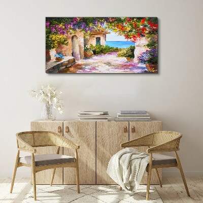 Foto op canvas De bloemenlaan van een kustdorp