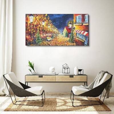 Foto op canvas Gouden laan in het schijnsel van lantaarns