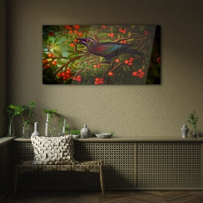 Foto op glas Een vogel tegen de achtergrond van een fruittak