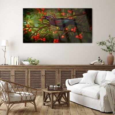 Foto op glas Een vogel tegen de achtergrond van een fruittak