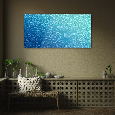 Foto op glas Waterdruppels op een blauwe achtergrond