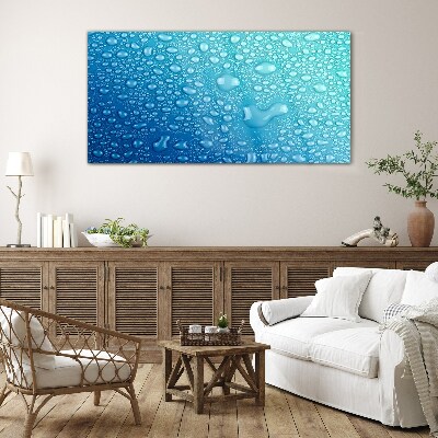 Foto op glas Waterdruppels op een blauwe achtergrond