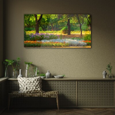 Schilderij op glas Een bloemenparadijs in een zonnige tuin