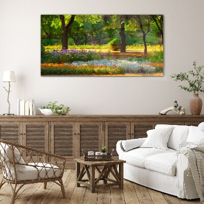 Schilderij op glas Een bloemenparadijs in een zonnige tuin