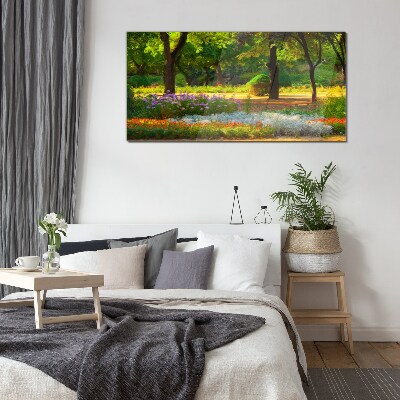 Schilderij op glas Een bloemenparadijs in een zonnige tuin