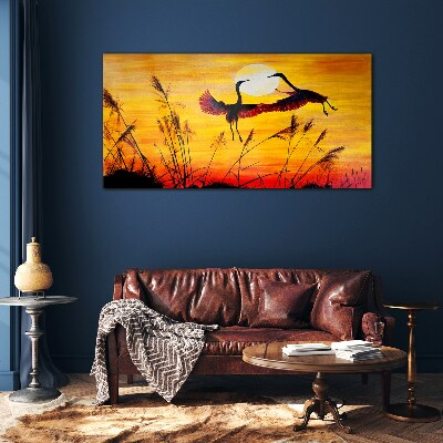 Foto op glas Dansende kraanvogels bij zonsondergang