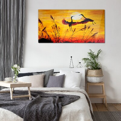 Foto op glas Dansende kraanvogels bij zonsondergang