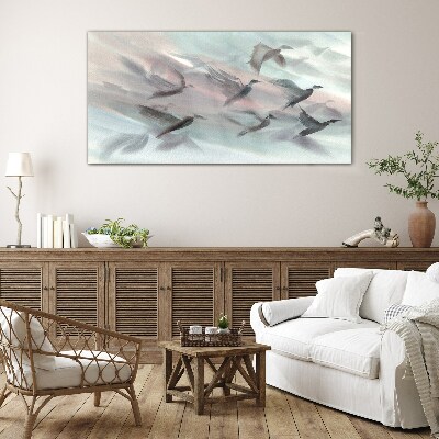 Foto op glas Vlucht van vogels in een pastelkleurige aura