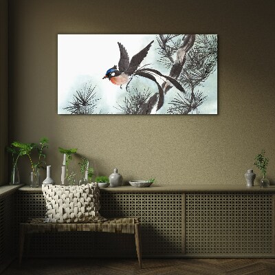 Foto op glas Een vogel in vlucht over de dennen