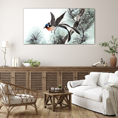 Foto op glas Een vogel in vlucht over de dennen