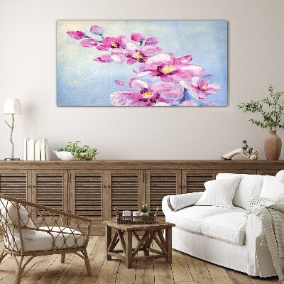 Foto op glas Roze orchideeën op een blauwe achtergrond