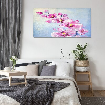 Foto op glas Roze orchideeën op een blauwe achtergrond