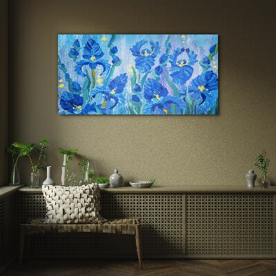 Schilderij op glas Blauwe irissen tegen een blauwe achtergrond